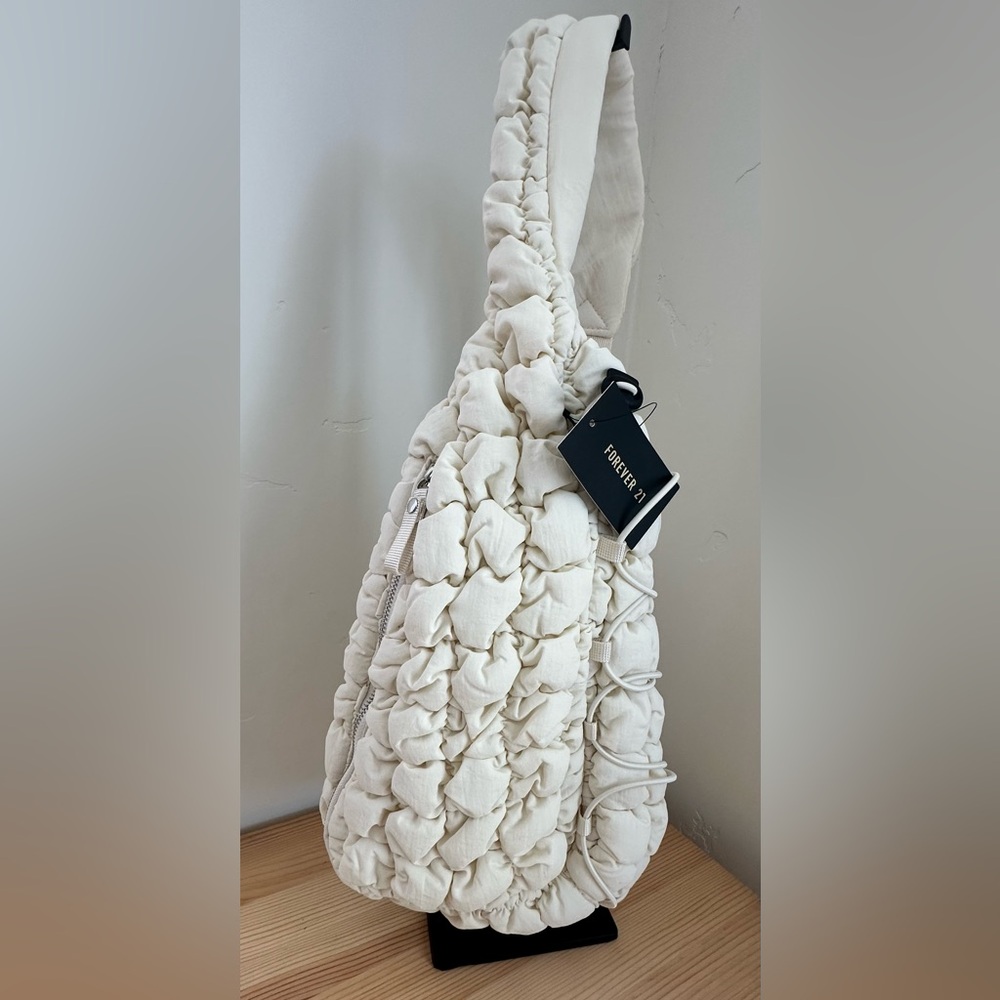 Forever 21 Ivory Textured Sling Bag  Adjustable Strap Front Zipper NWT